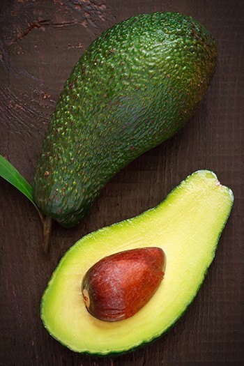 ripe avocado sliced in half