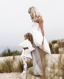 silk lady with child on the beach